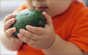 child eating fruit